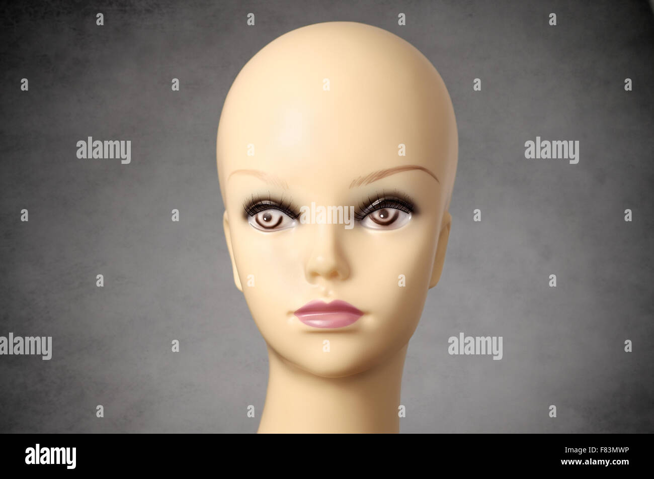 Closeup of a female mannequin head on gray background Stock Photo Alamy