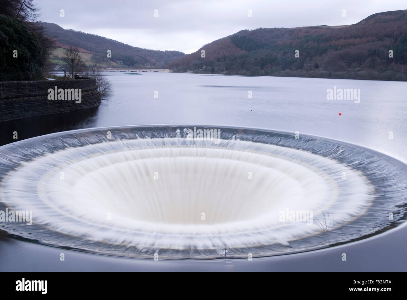 DERBYSHIRE UK - 06 Oct : Ladybower reservoir bellmouth overflow plug hole and draw off tower on 16 Feb 2014 in the Peak District Stock Photo
