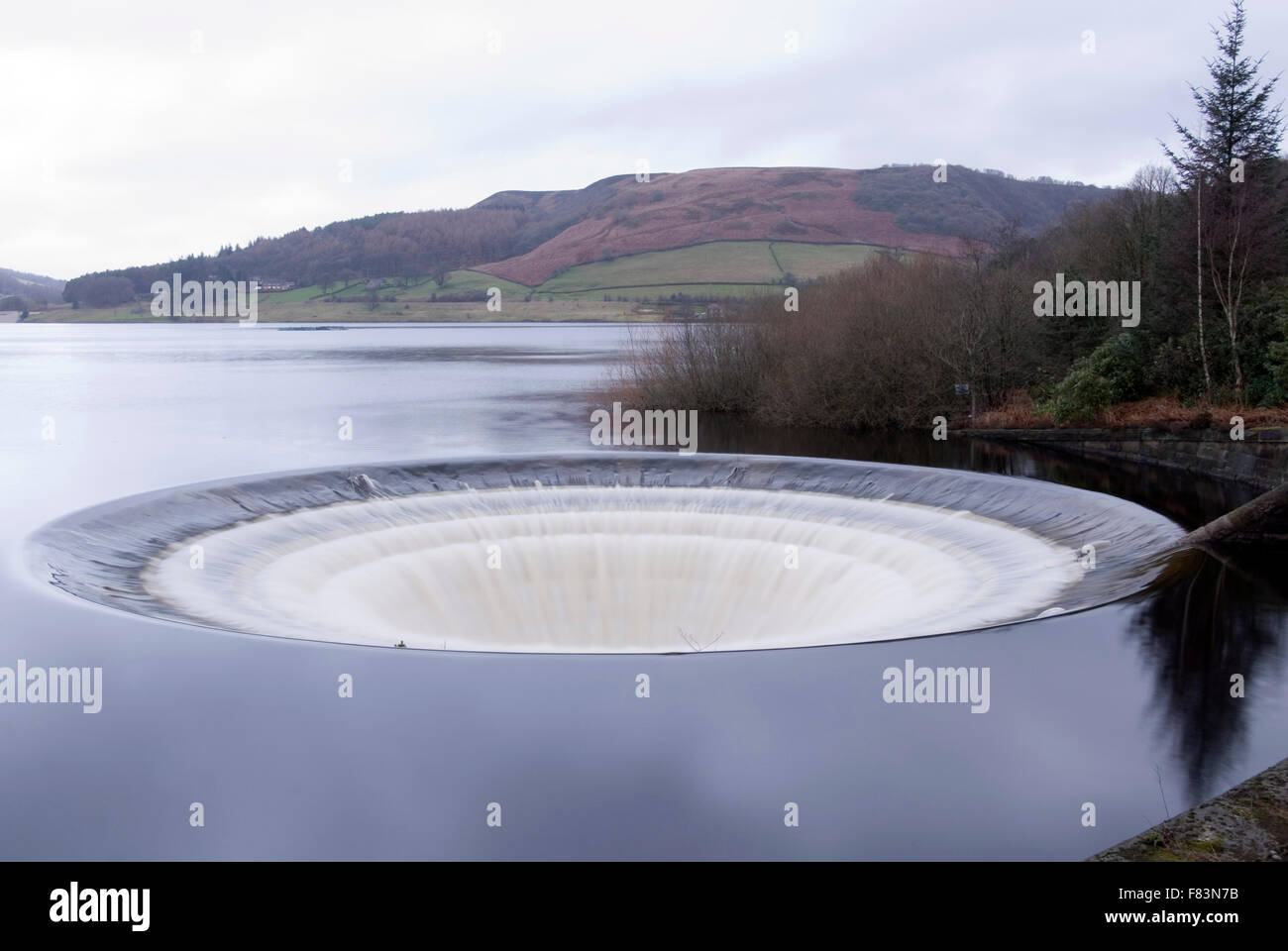 DERBYSHIRE UK - 06 Oct : Ladybower reservoir bellmouth overflow plug hole and draw off tower on 16 Feb 2014 in the Peak District Stock Photo