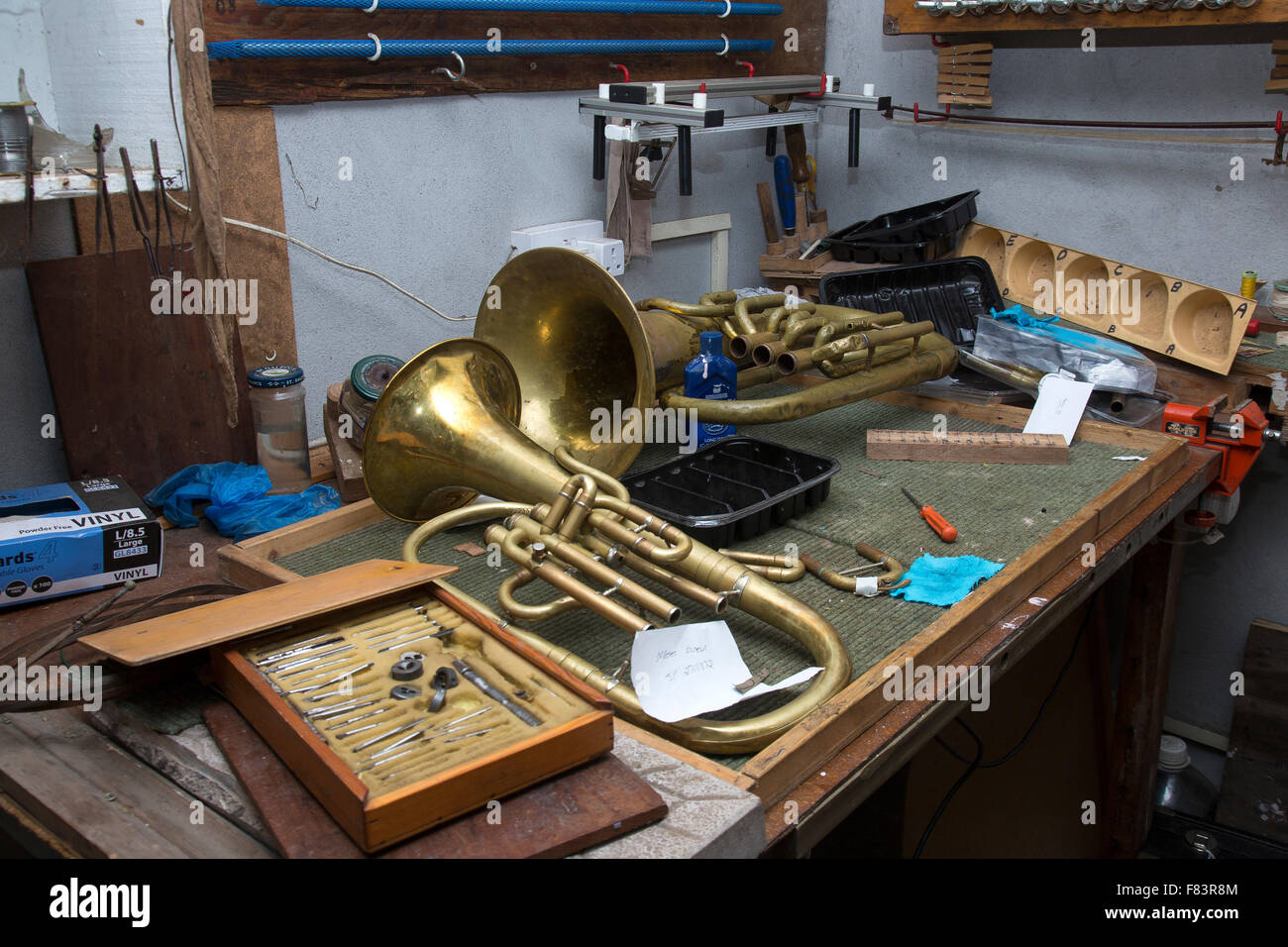 Workbench and tools for musical instrument repair. Stock Photo