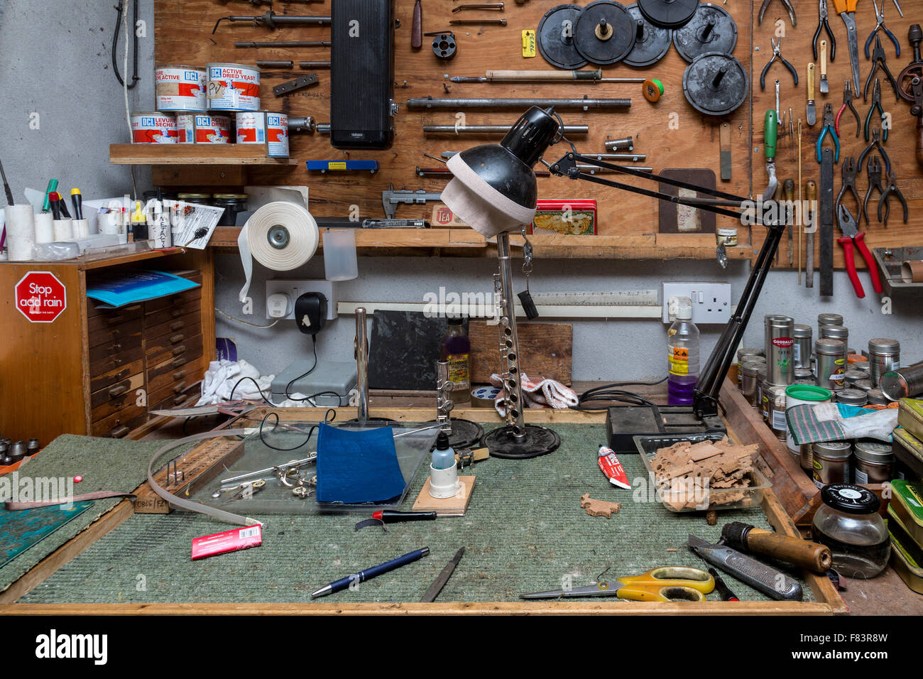 Workbench and tools for musical instrument repair. Stock Photo