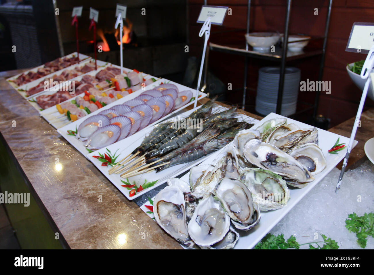 Table with catering food include seafood and meat Stock Photo - Alamy