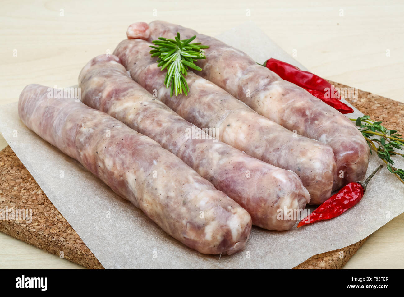 Handmade sausages for grill with rosemary and spices Stock Photo Alamy