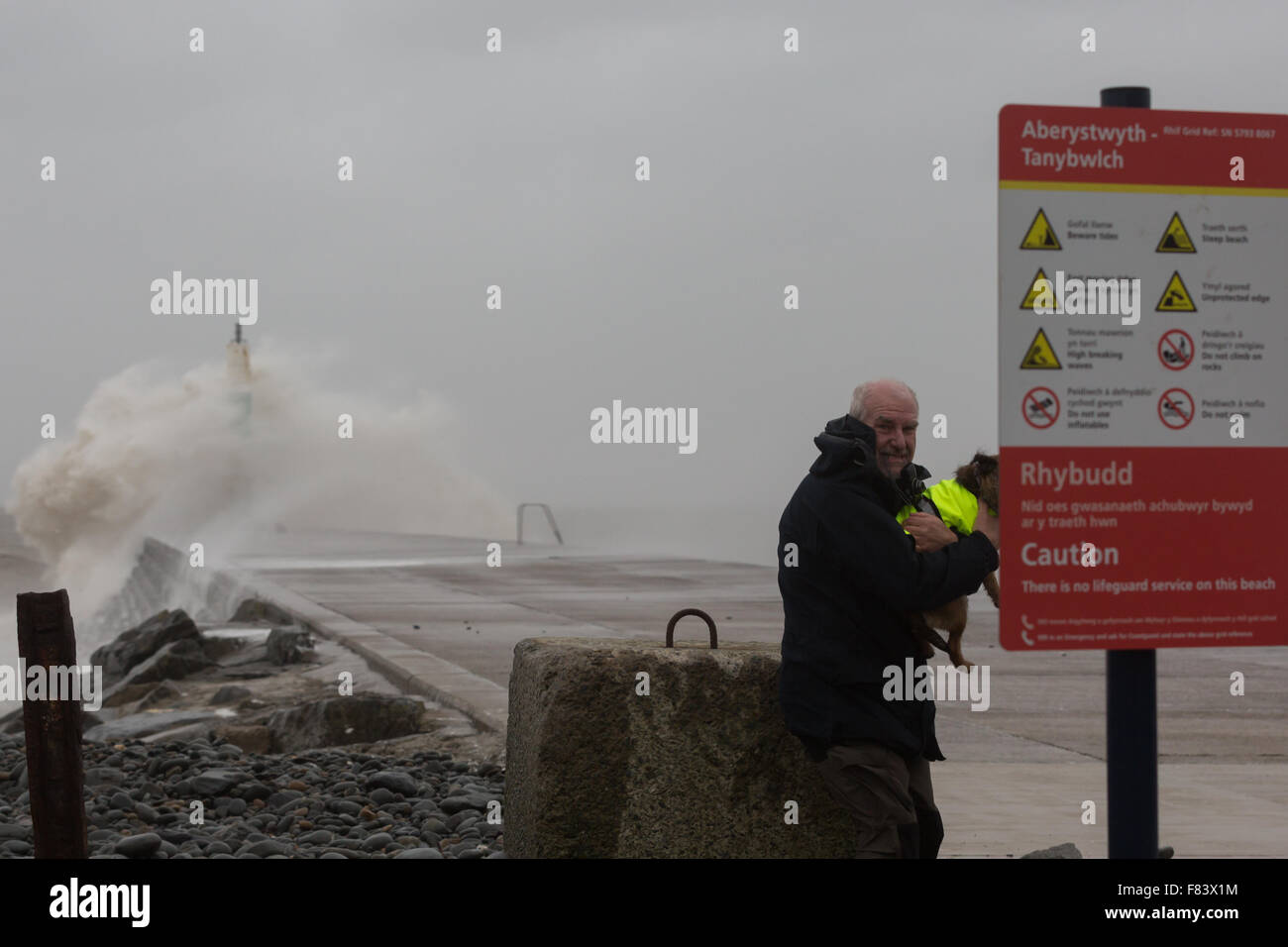 Wales, UK. 05th December 2015 Storm Desmond, the 4th named recent storms brings gale force winds and rough seas to Aberystwyth, battering the jetty near the harbour entrance on the west coast of Wales. Credit:  Ian Jones/Alamy Live News Stock Photo