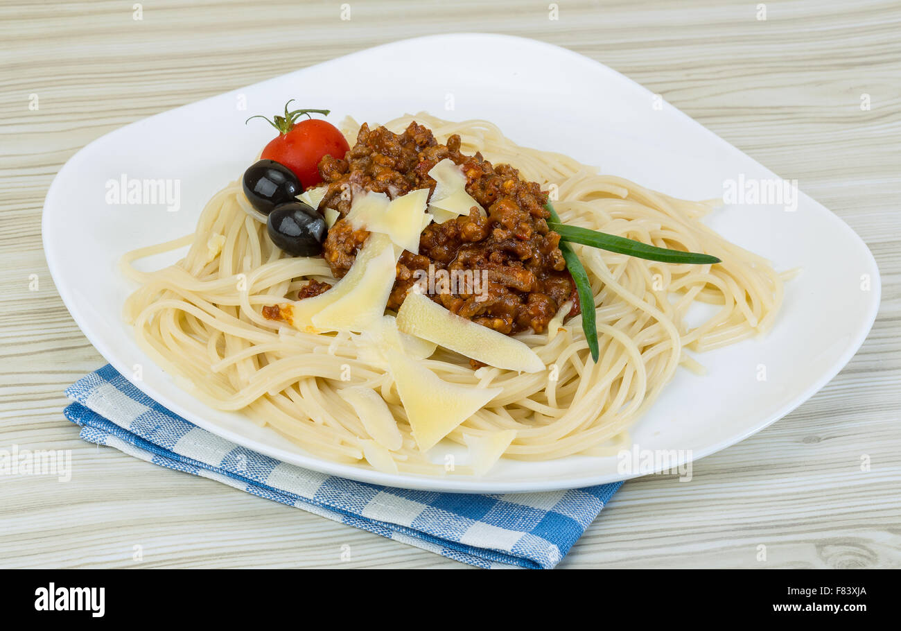 Spaghetti Bolognese with parmesan cheese and black olives Stock Photo