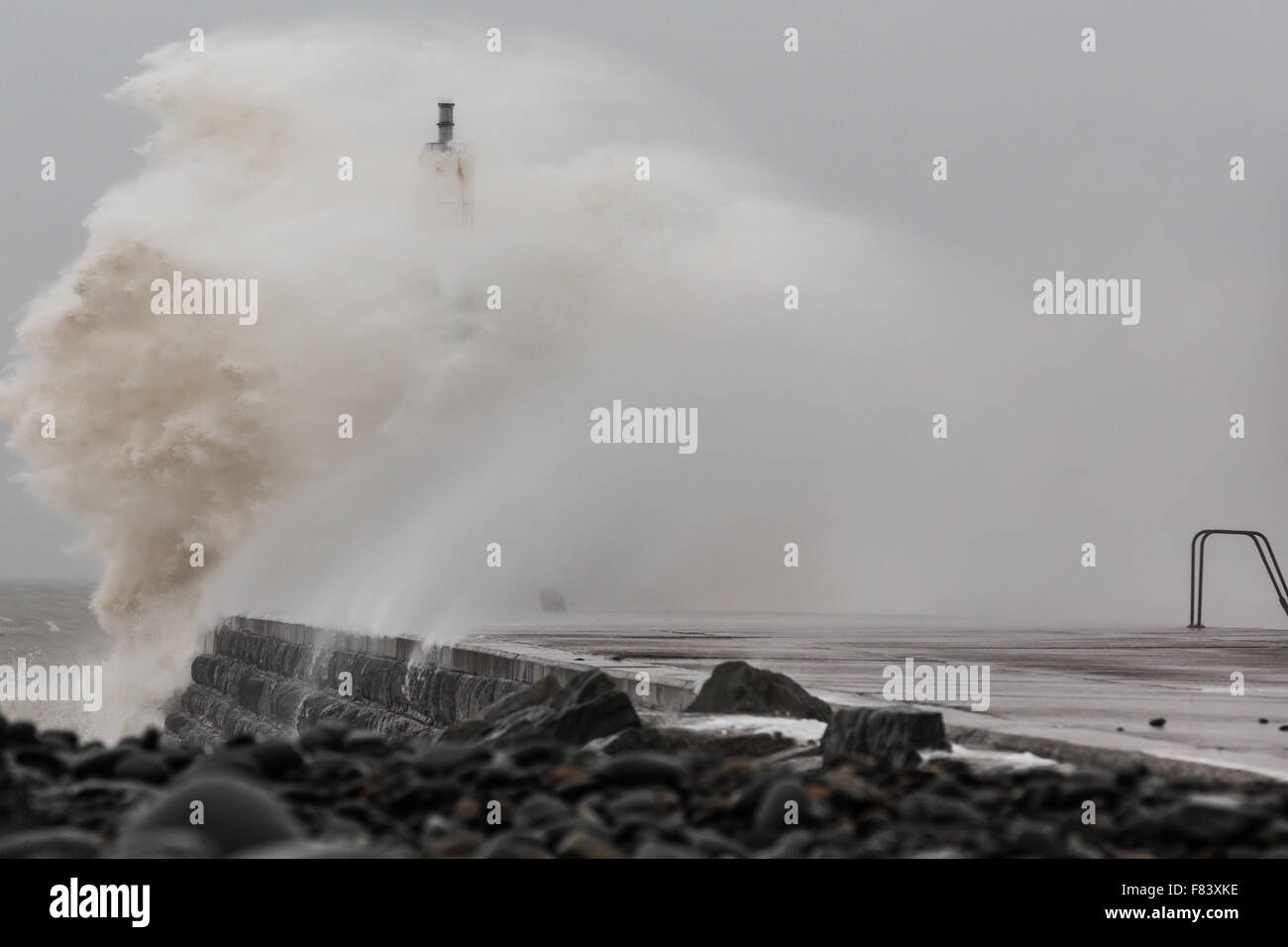 Wales, UK. 05th December 2015 Storm Desmond, the 4th named recent storms brings gale force winds and rough seas to Aberystwyth, battering the jetty near the harbour entrance. Credit:  Ian Jones/Alamy Live News Stock Photo