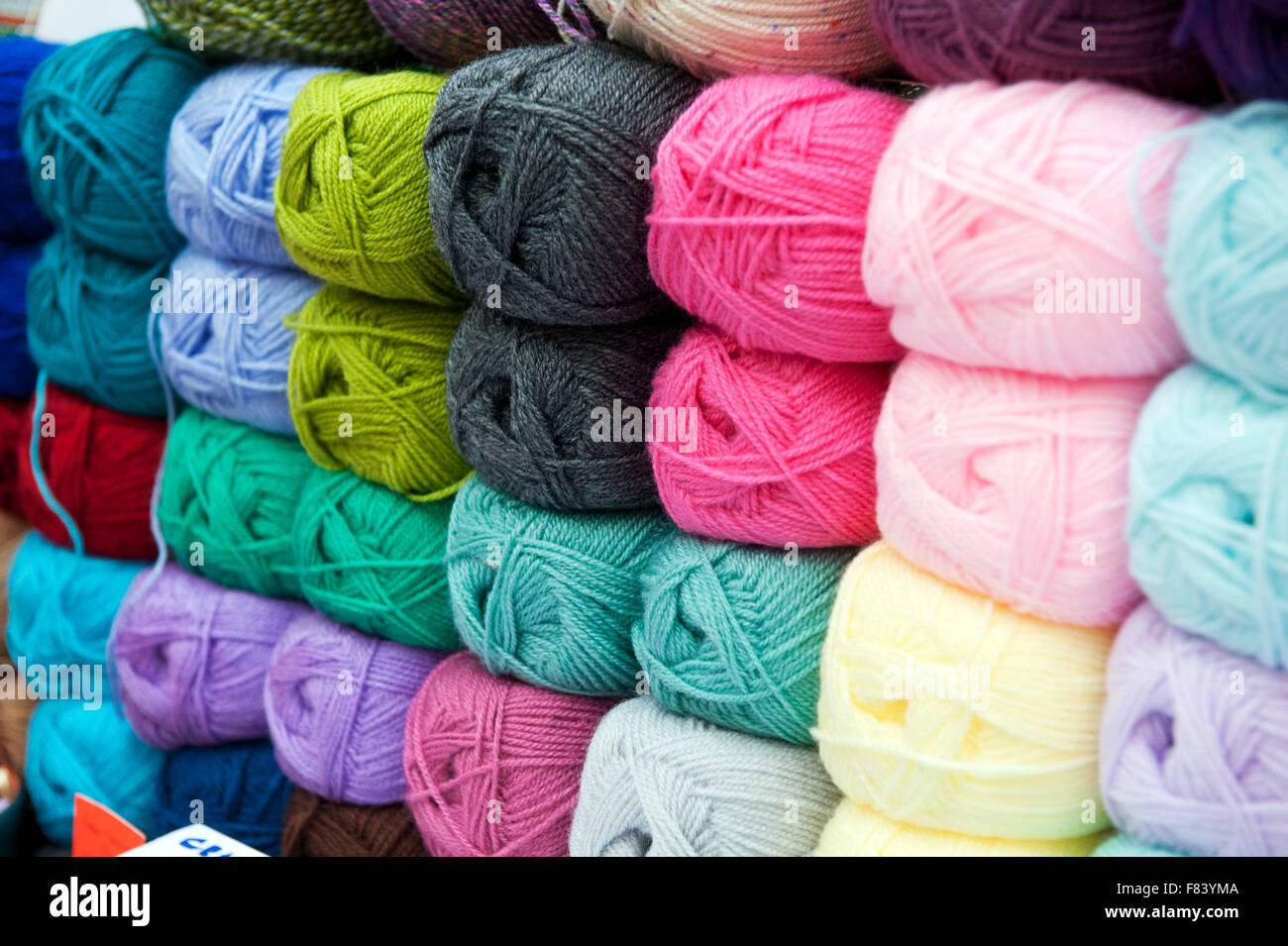 Different colors of wool on market for sale England UK Europe Stock Photo