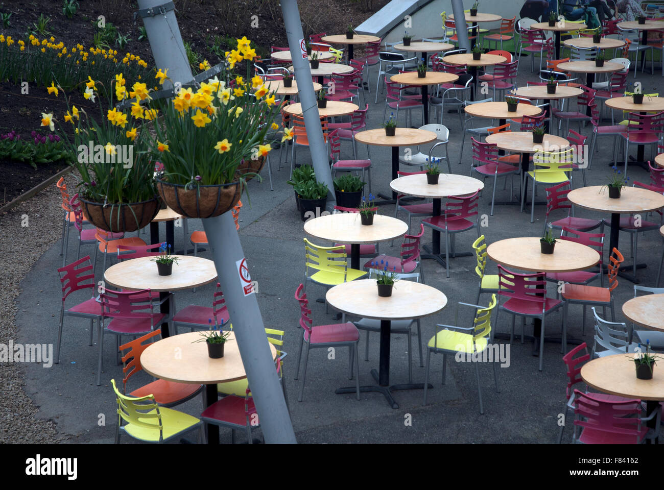 Empty tables in and empty cafe outside one of the biomes Eden Project, Bodelva, Cornwall PL24 2SG Stock Photo