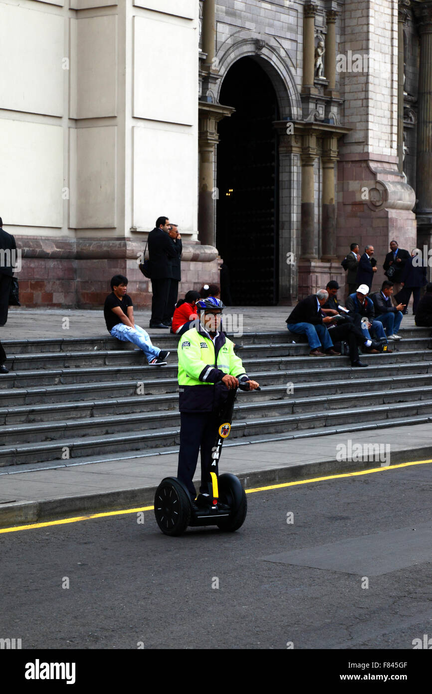 Serenazgo municipal security guard on Segway Personal Transporter in front of cathedral, Plaza de Armas, Lima, Peru Stock Photo