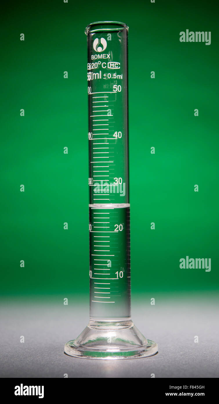Graduated cylinder containing 25 ml of clear fluid Stock Photo