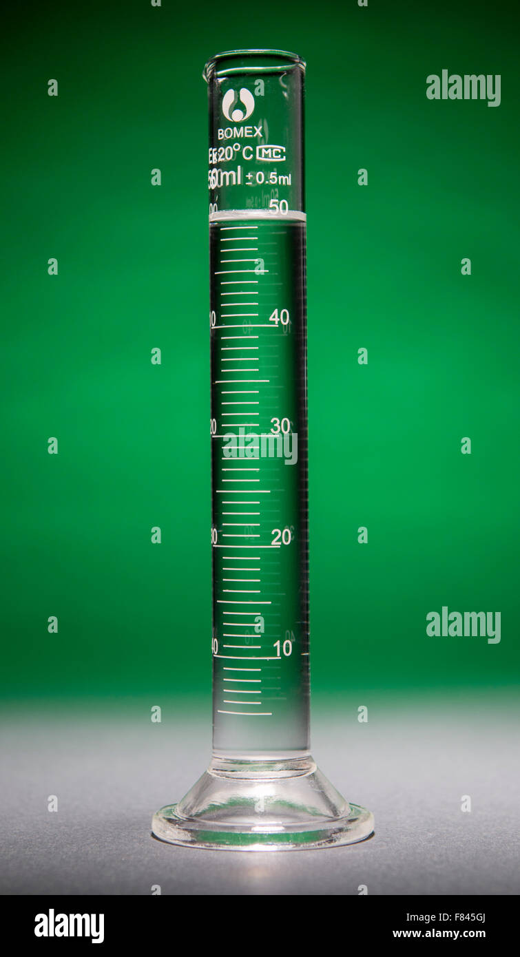 Graduated cylinder containing 50 ml of clear fluid Stock Photo