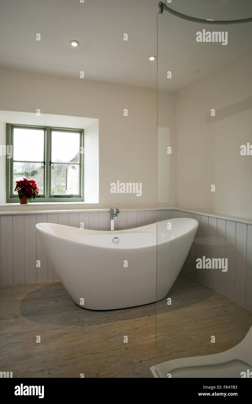 A stylish bathroom with an unusual free standing bath Stock Photo - Alamy