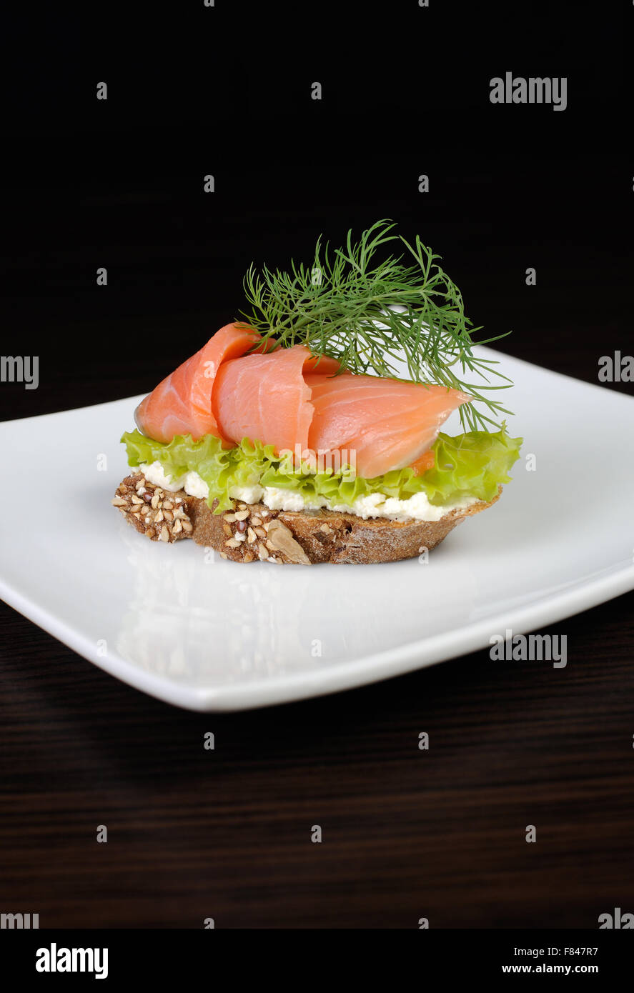rye bread canapes with salmon and ricotta Stock Photo