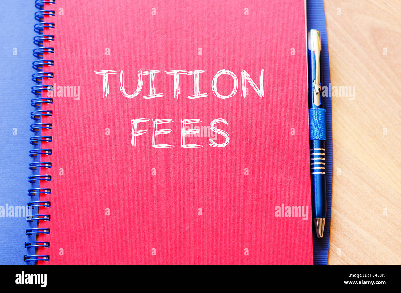 Tuition fees text concept write on notebook with pen Stock Photo - Alamy