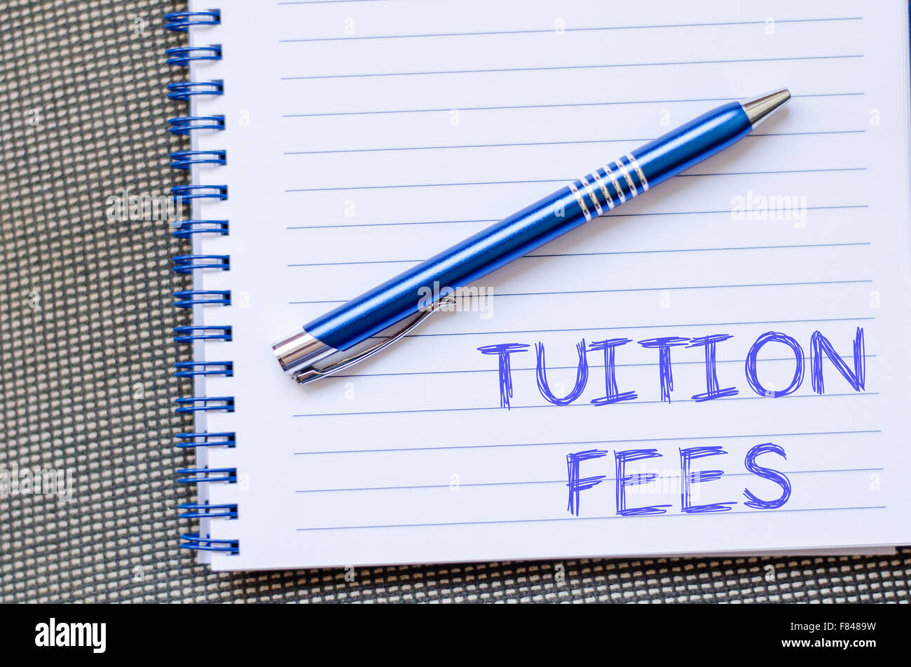 Tuition fees text concept write on notebook with pen Stock Photo - Alamy