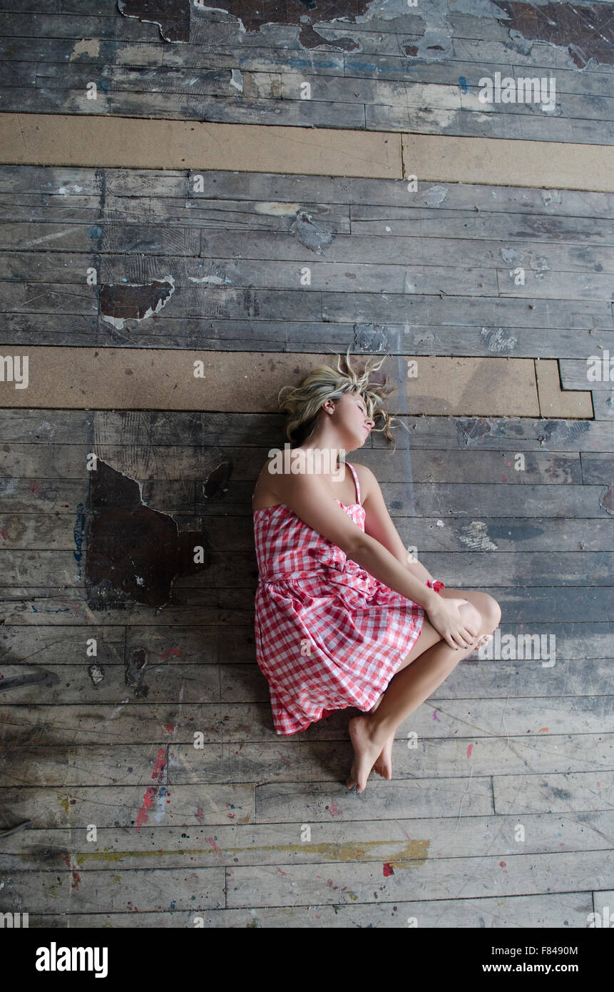 Young woman sleeping on the floor Stock Photo Alamy