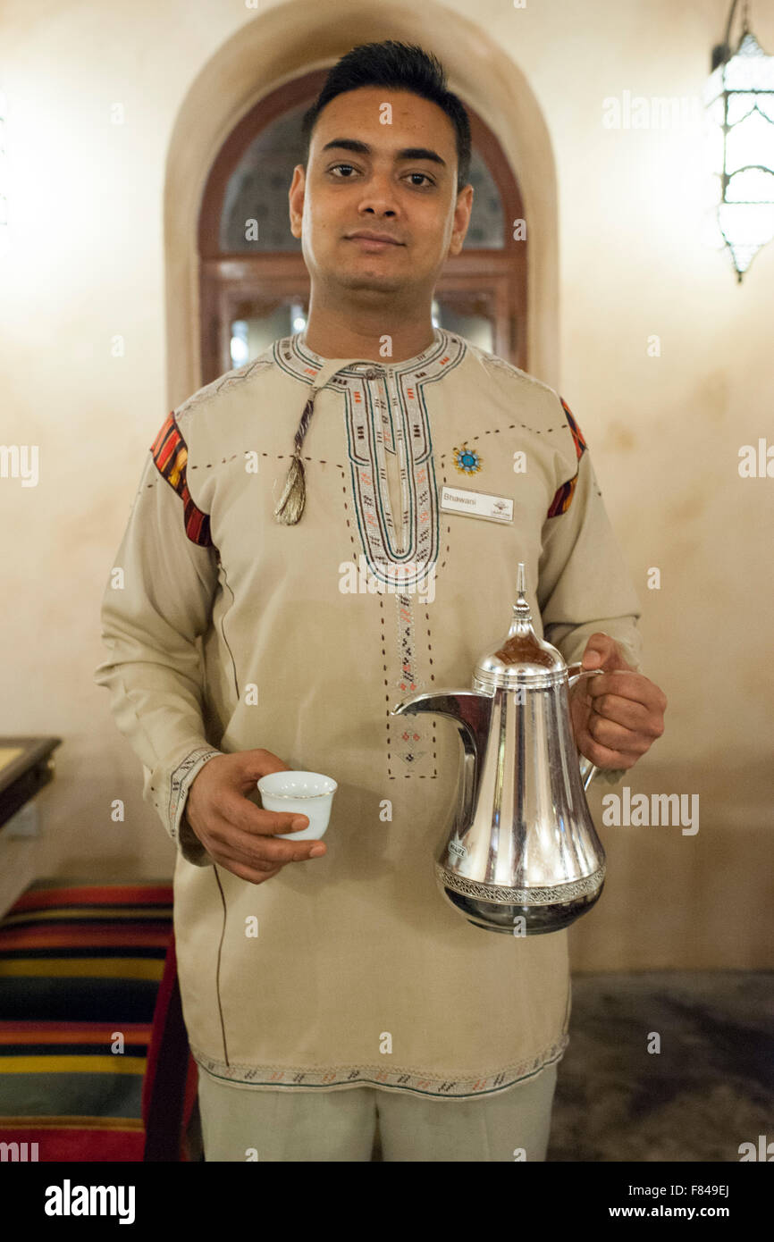 A waiter serving coffee in the Bait Al Luban restaurant in Muscat, the capital of the Sultanate of Oman. Stock Photo