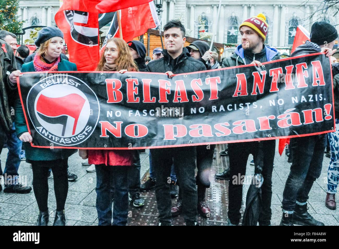 Belfast, Northern Ireland. 05 Dec 2015 - Pro-refugee supporters from 'Belfast Antifa' gather to protest against the Protestant Coalition's anti-refugee rally, with the message 'No Fascists. No Racists. No Nazis'.  While they were protesting a small group of neo-nazis appreared and gave a Nazi salute.  Credit:  Stephen Barnes/Alamy Live News Stock Photo