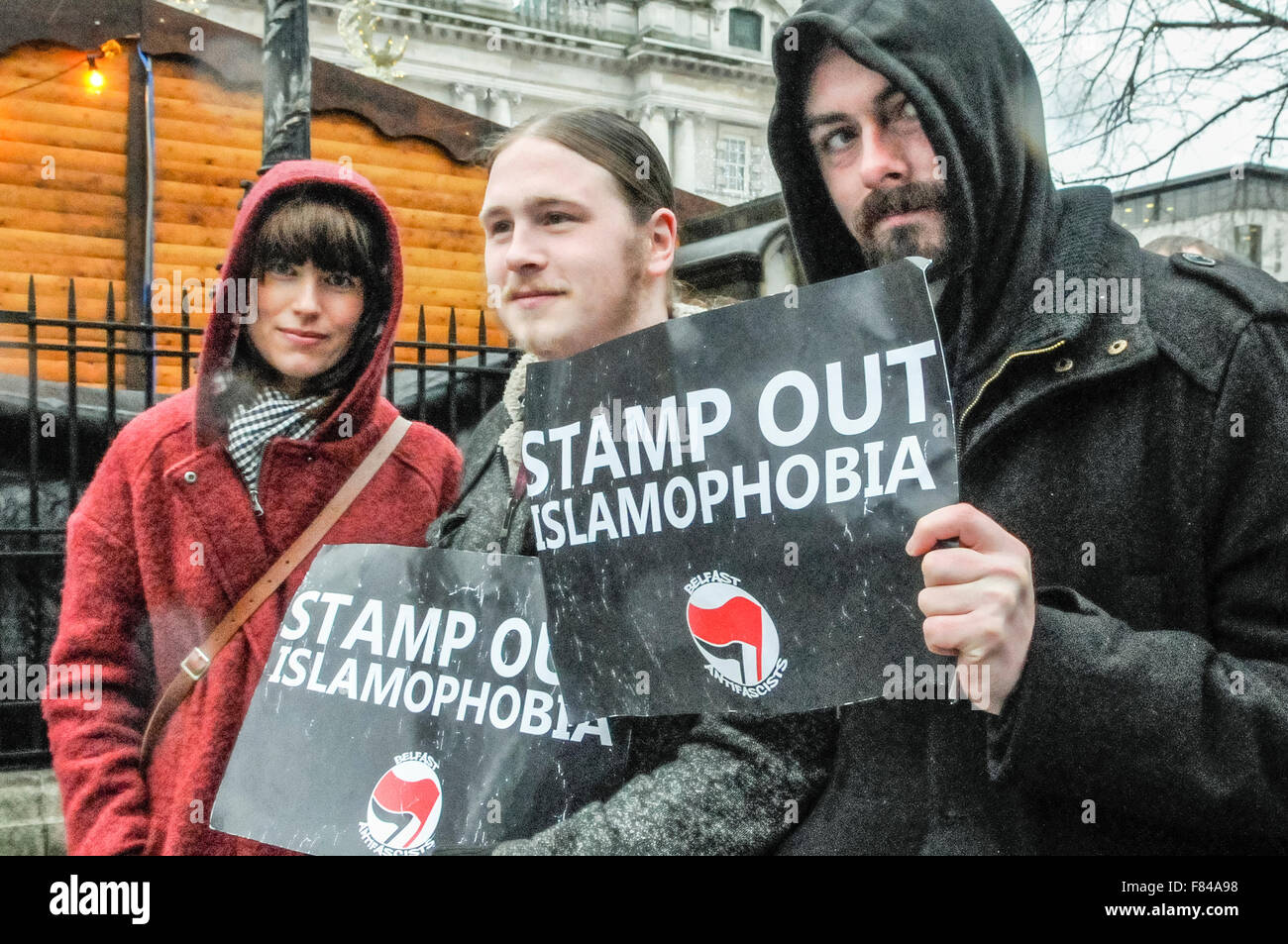 Belfast, Northern Ireland. 05 Dec 2015 - Men hold signs saying 'Stamp Out Islamophobia' at a pro-refugee gathering to protest against the Protestant Coalition's anti-refugee rally. Credit:  Stephen Barnes/Alamy Live News Stock Photo
