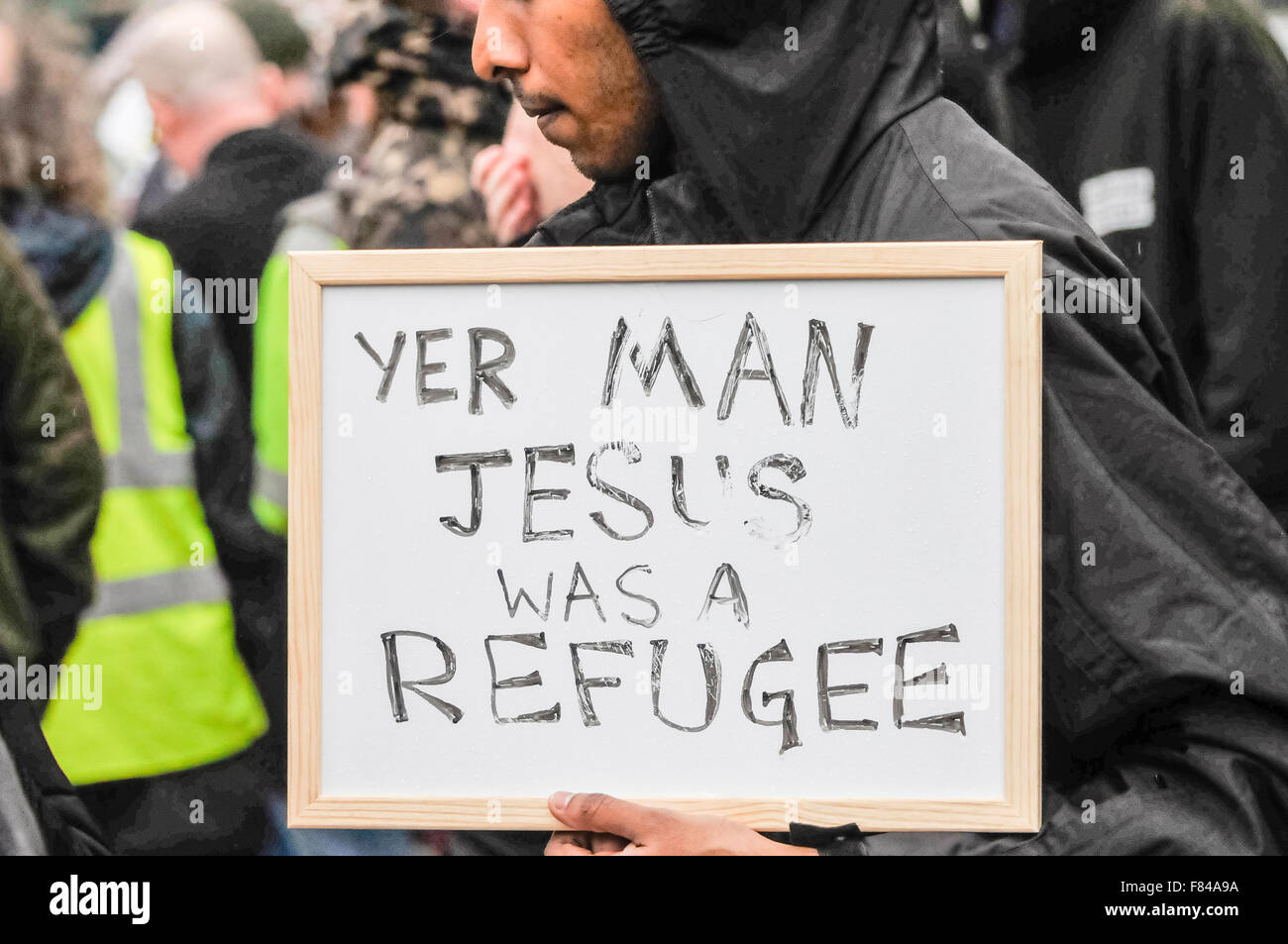 Belfast, Northern Ireland. 05 Dec 2015 - A man holds a sign saying 'Yer [Your] man Jesus was a refugee'. Credit:  Stephen Barnes/Alamy Live News. Stock Photo