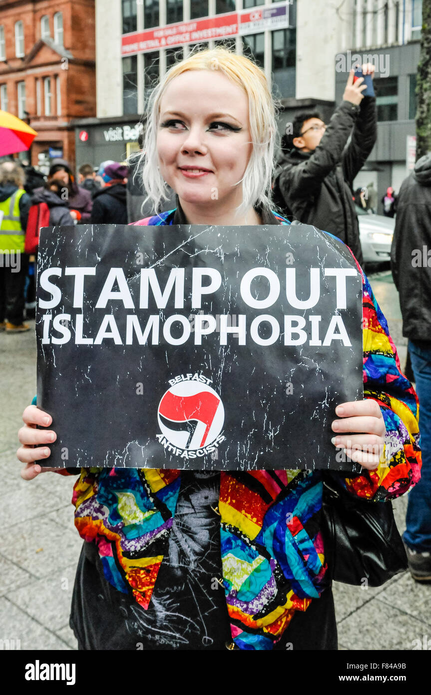 Belfast, Northern Ireland. 05 Dec 2015 - A woman holds a sign saying 'Stamp Out Islamophobia' at a pro-refugee gathering to protest against the Protestant Coalition's anti-refugee rally. Credit:  Stephen Barnes/Alamy Live News Stock Photo