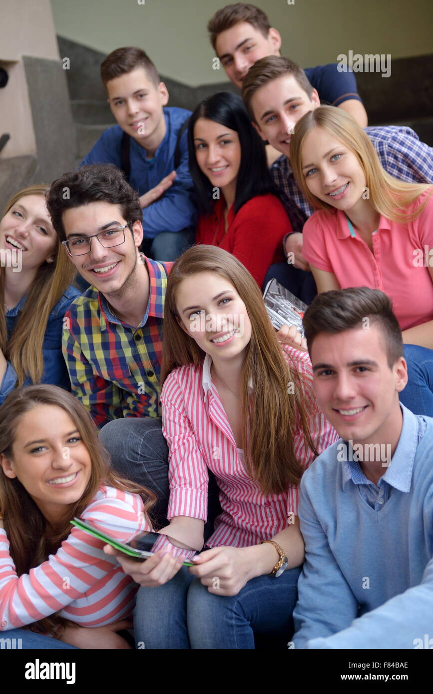 happy young teens group in school have fun an learning lessons Stock