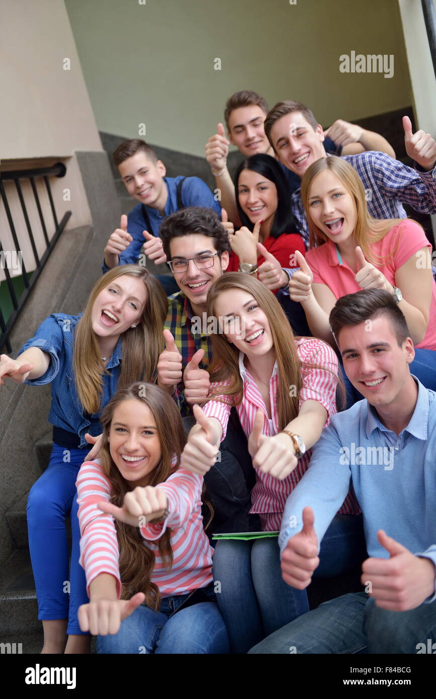 happy young teens group in school have fun an learning lessons Stock
