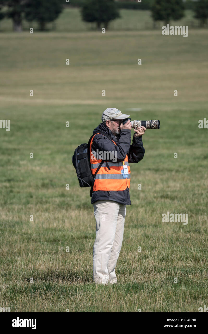 a photographer with a zoom lens Stock Photo Alamy