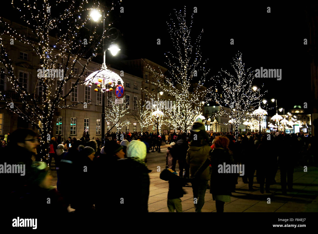 Warsaw, Poland. 05th Dec, 2015. Thousands of people from across Poland and across the globe came to the capital of Poland, Warsaw, to see the annual Christmas tree lighting ceremony. The Christmas tree was lit in the old city square near the royal castle the day before the Feast of St. Nicholas. In Poland this feast day is celebrated widely, with children being visited by St. Nicolas, also known as Santa Clause, and asking him for what they want for Christmas. It is also a religious holiday celebrating the Saint. Credit:  Anna Ferensowicz/ Pacific Press/Alamy Live News Stock Photo