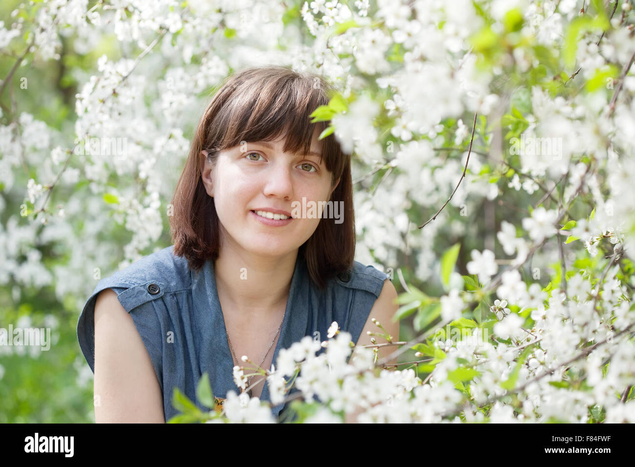 portrait of girl in spring blossoming garden Stock Photo - Alamy