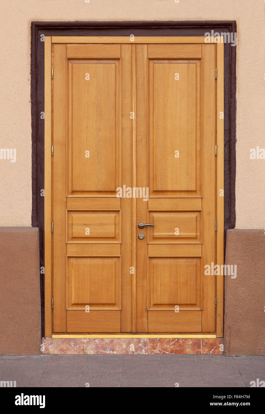 Contemporary modern entrance doors with square panels and dark frame Stock Photo Alamy