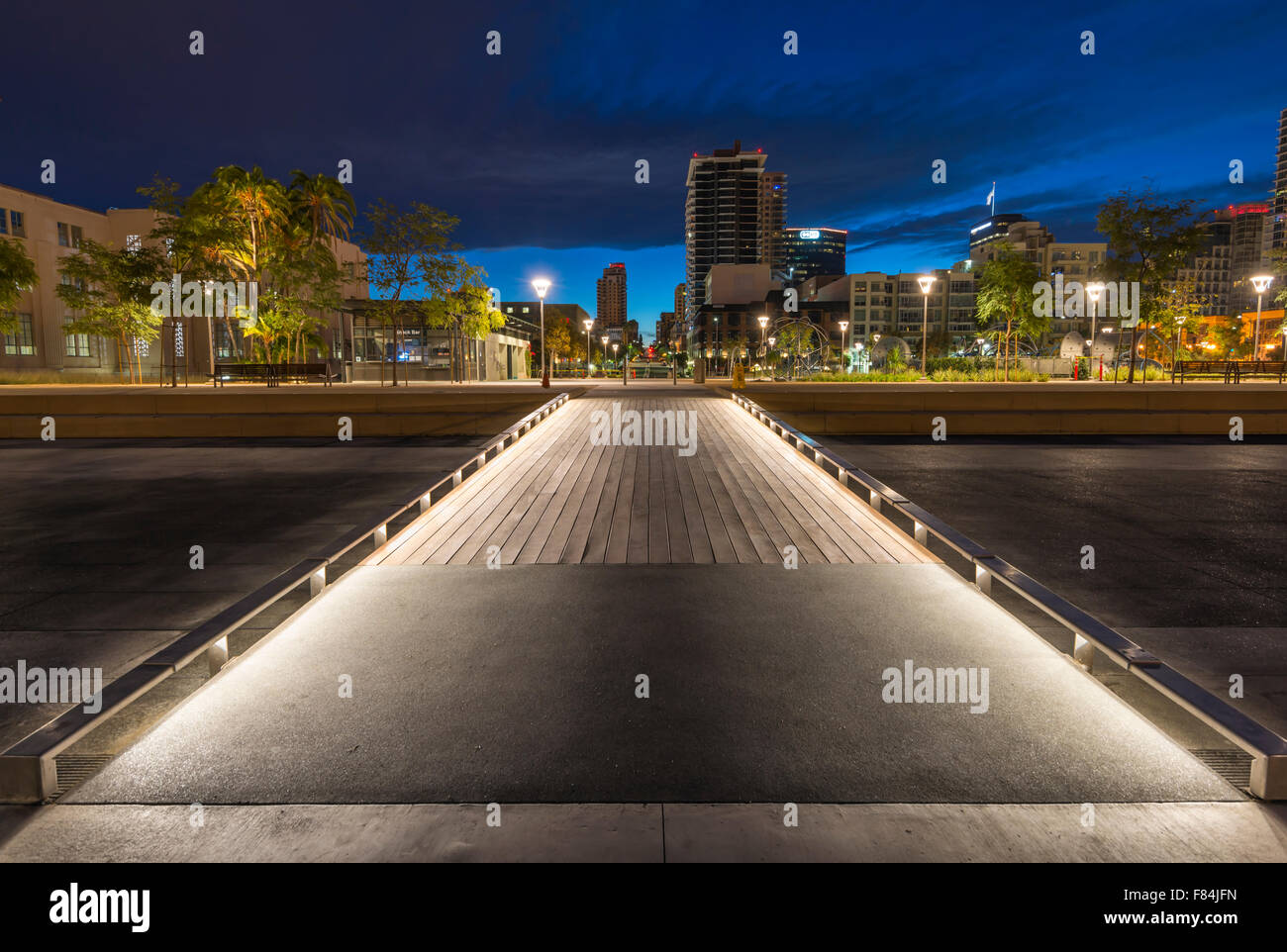 Lighted ramp at Waterfront Park and downtown buildings at dawn. San ...