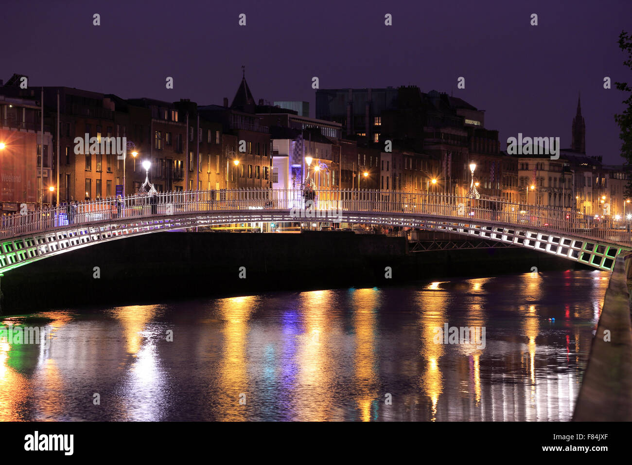 The night view of Ha'penny Bridge over River Liffey. Dublin Ireland ...