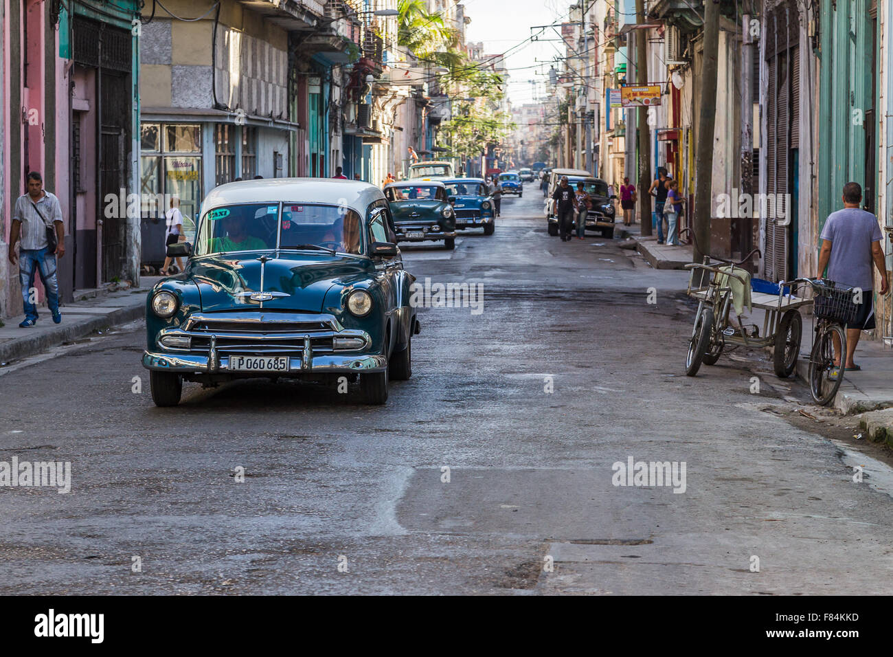Calle Neptuno in Centro Havana early one morning - wide awake with the sound of vintage cars rumbling down the streets. Stock Photo