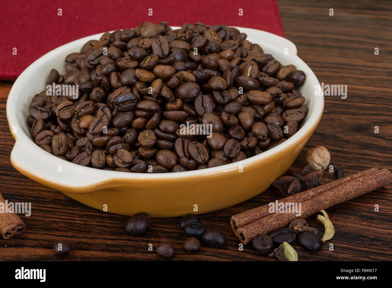 Roasted coffee beans in the bowl with cinamon Stock Photo - Alamy