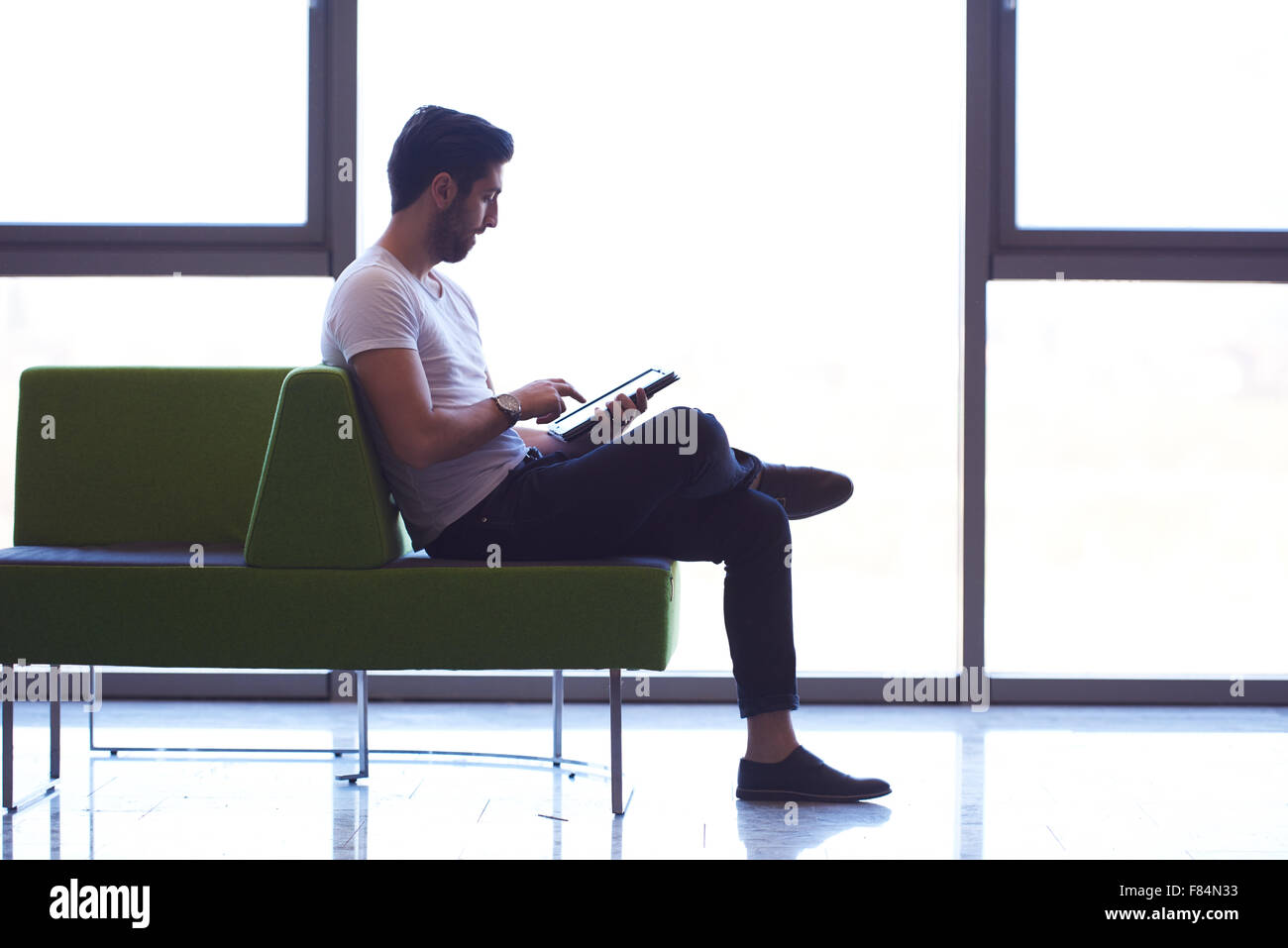student working on tablet computer at university school modern interior ...