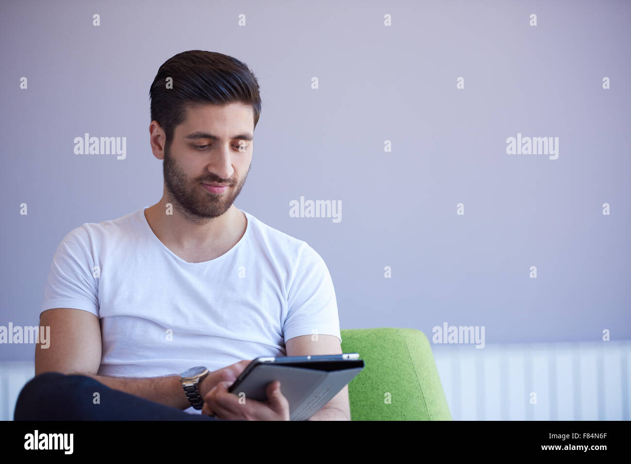 student working on tablet computer at university school modern interior ...