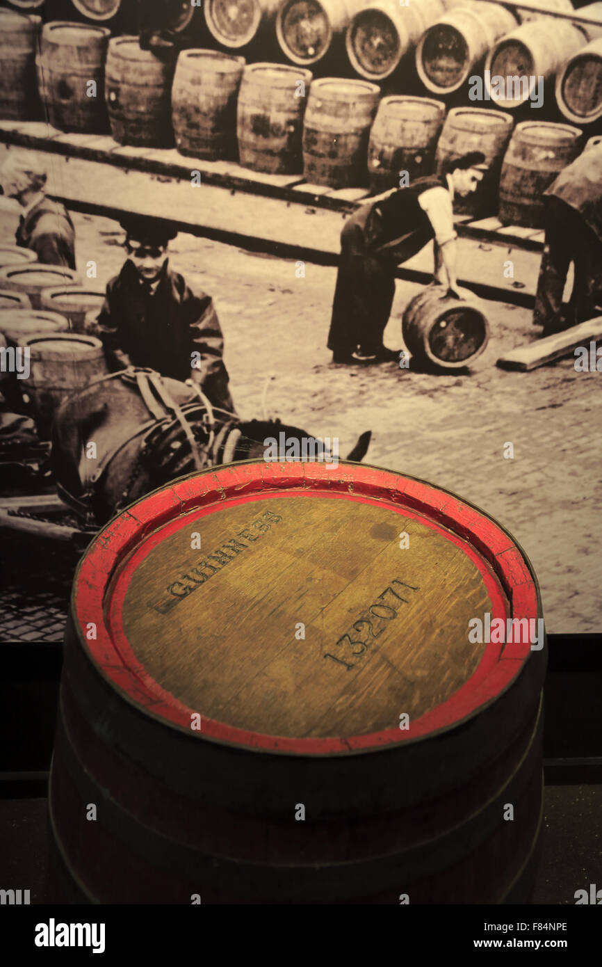 An old wooden beer barrel display in front of black and white