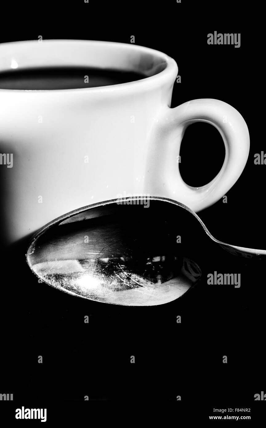 Abstract cup of coffee on black background Stock Photo - Alamy