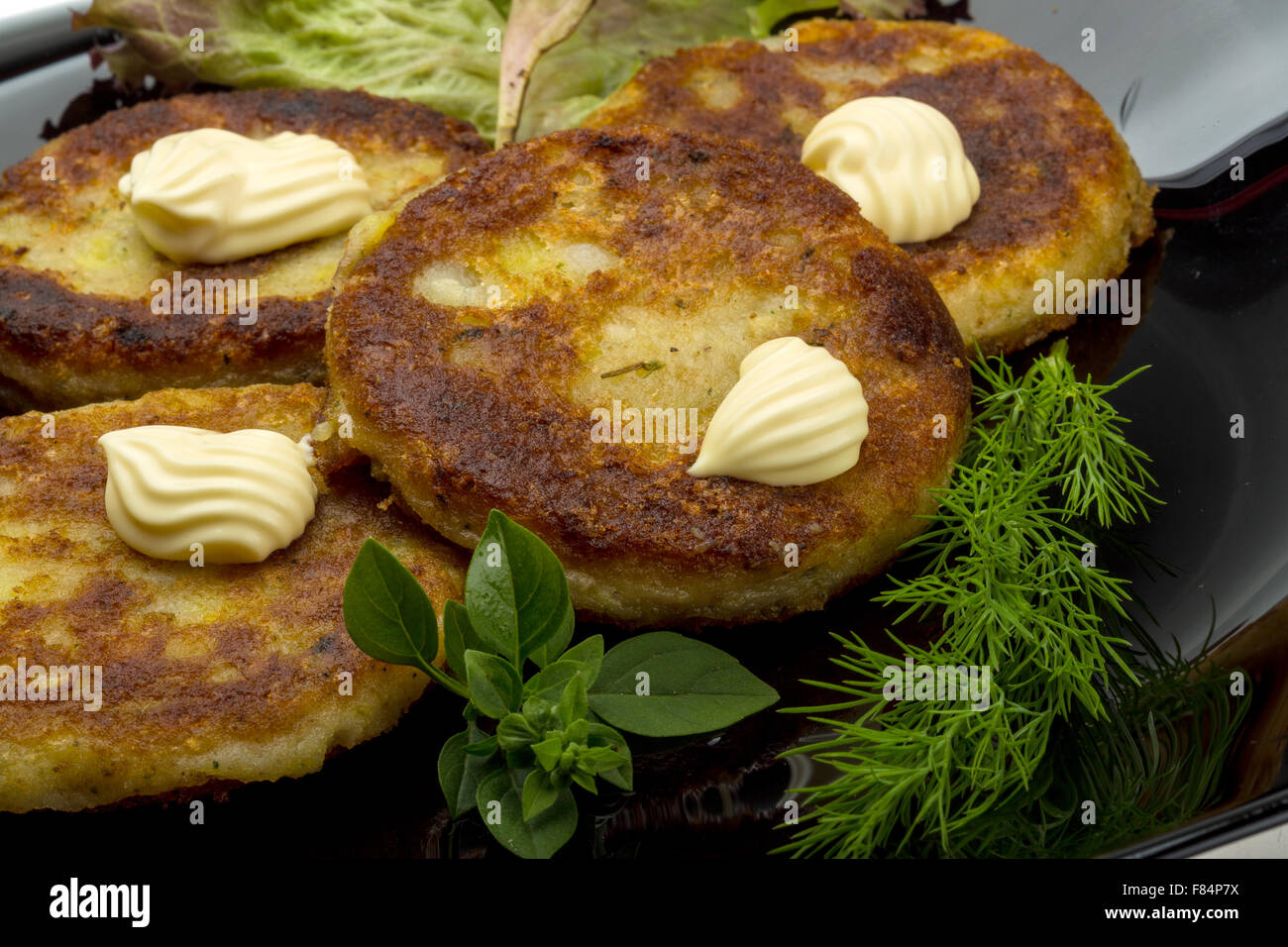 Hash browns with herbs on the plate Stock Photo Alamy