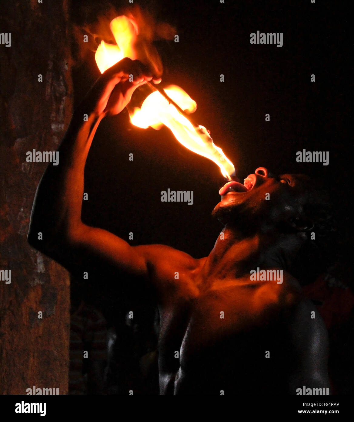 Man swallowing fire at Bassare T'Bol fire dance, Sokodé, Togo Stock Photo