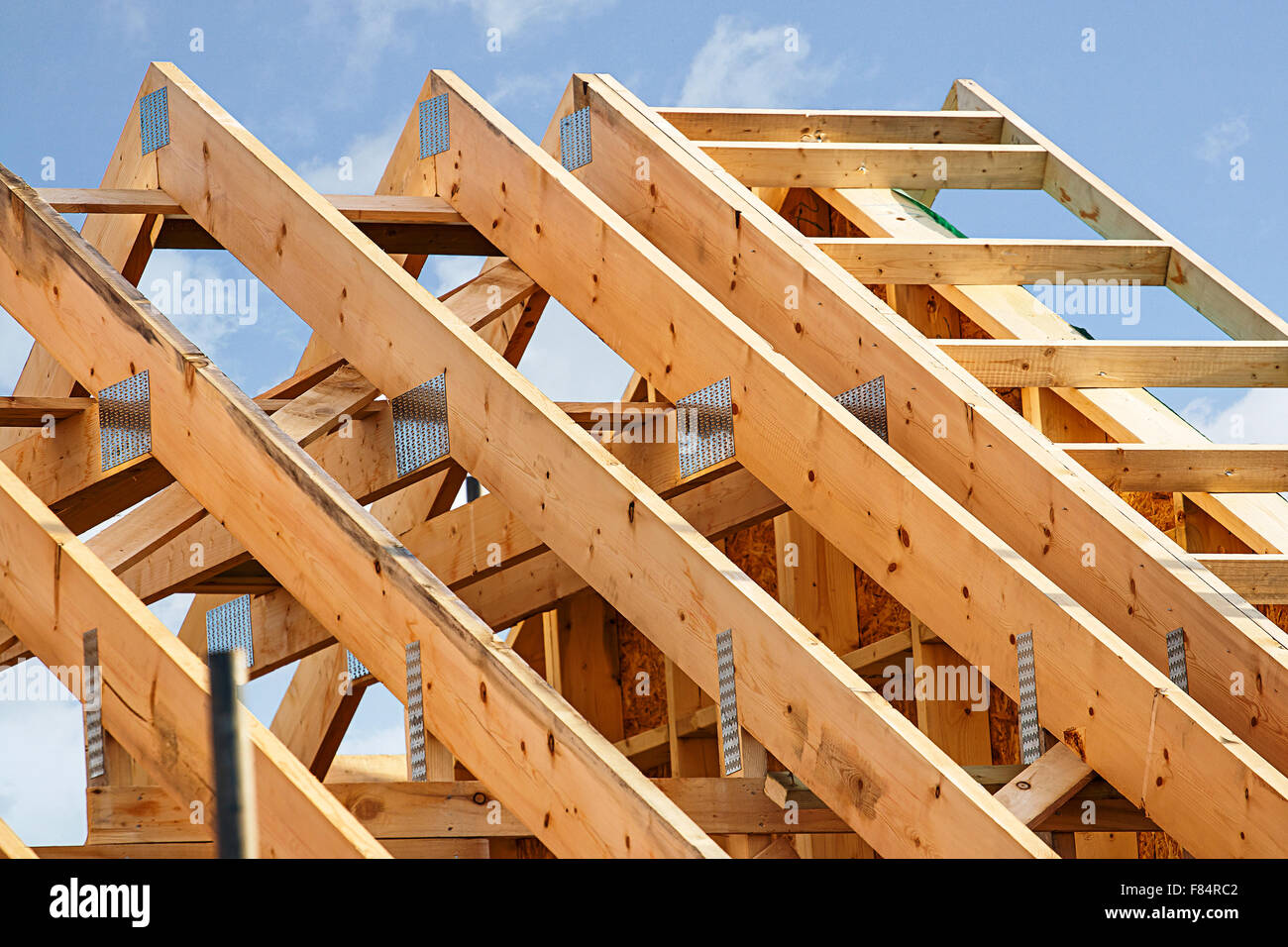 Standard timber framed building with close up on the roof trusses Stock Photo
