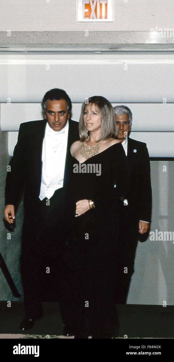 Washington, DC. USA 28th March, 1993 Barbra Streisand arrives as a guest of President William Clinton's  party at the annual white tie Gridiron Club dinner held at the Capitol Hilton Hotel.  The Gridiron Club and Foundation, founded in 1885, is the oldest and one of the most prestigious journalistic organizations in Washington, D.C. Its 65 active members represent major newspapers, news services, news magazines and broadcast networks. Credit: Mark Reinstein Stock Photo