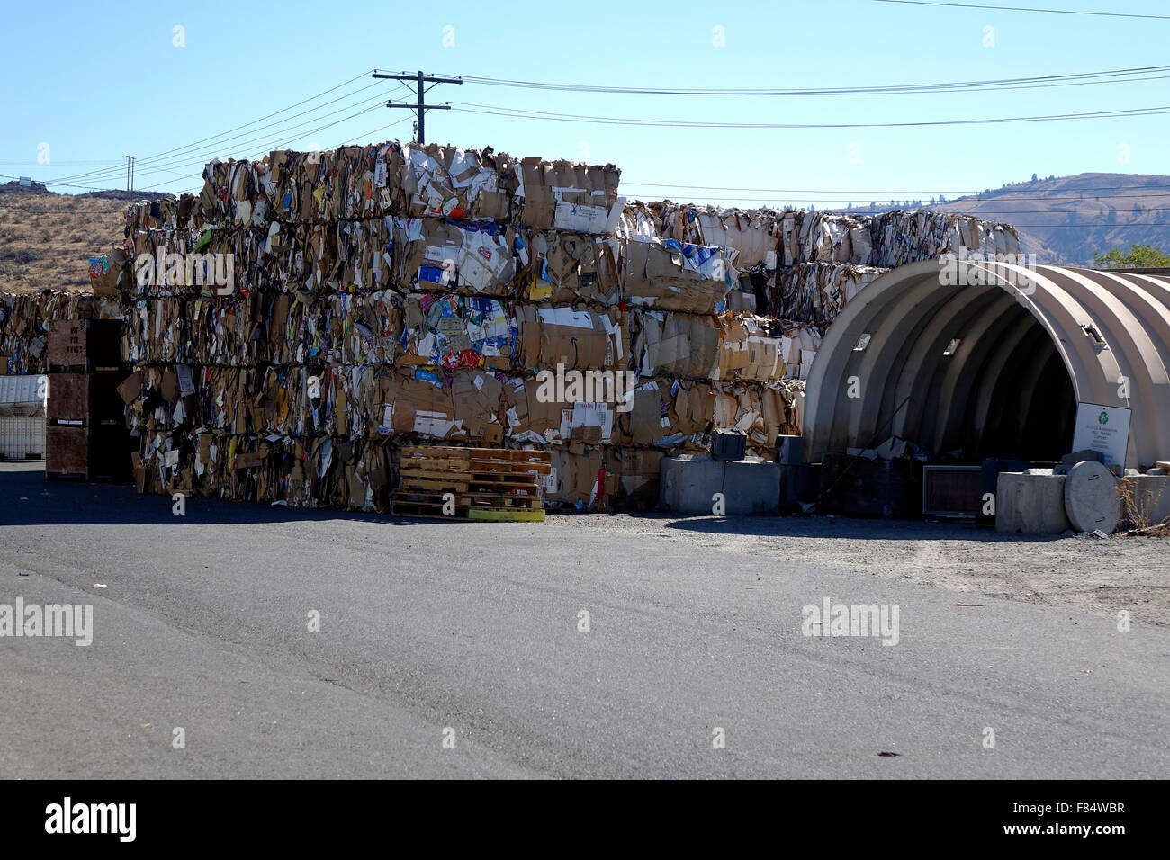 Used cardboard is delivered to a recycle center where it is flattened