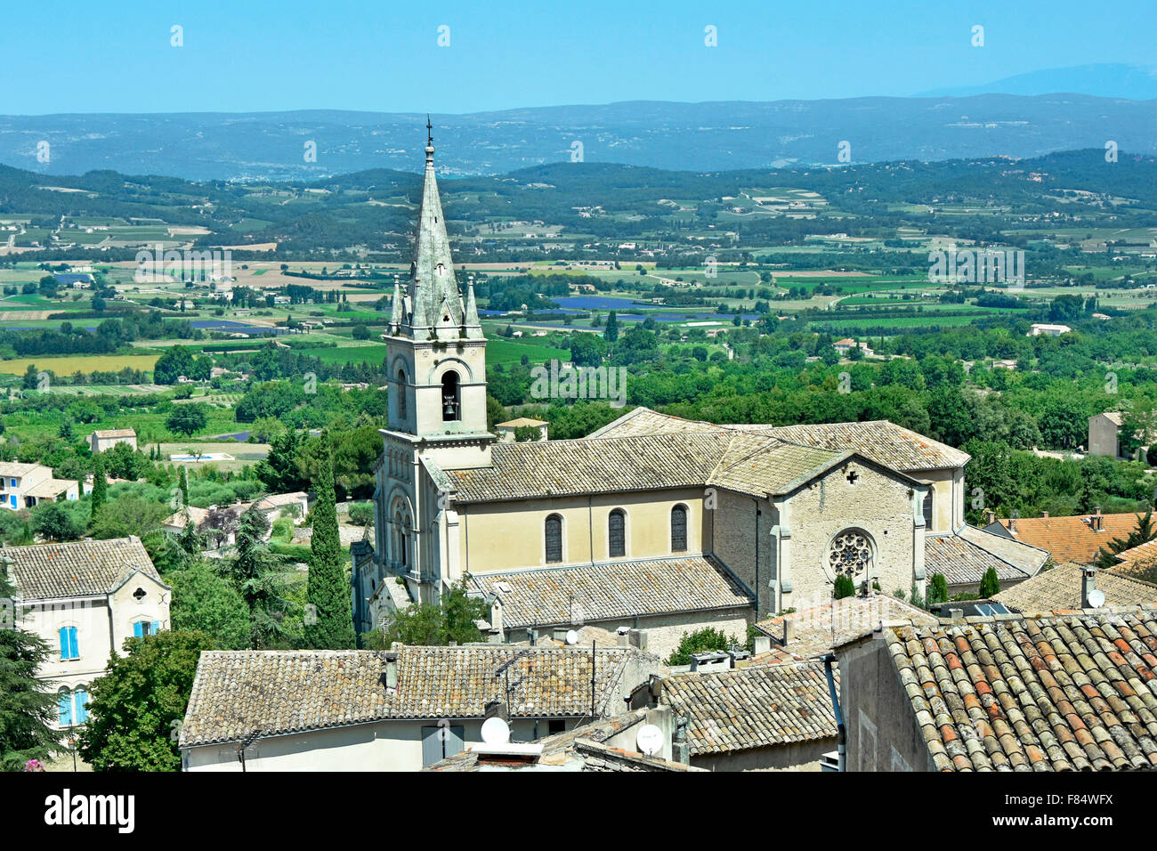 Bonnieux France church with views across the Calavon plain beyond Luberon, Vaucluse Provence-Alpes-Côte d'Azur Stock Photo