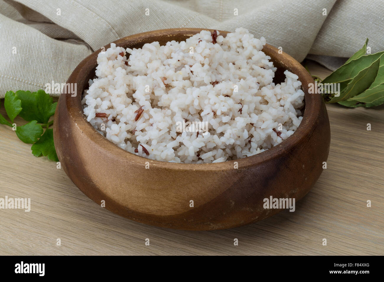 Boiled rice in the bowl on wooden background Stock Photo - Alamy