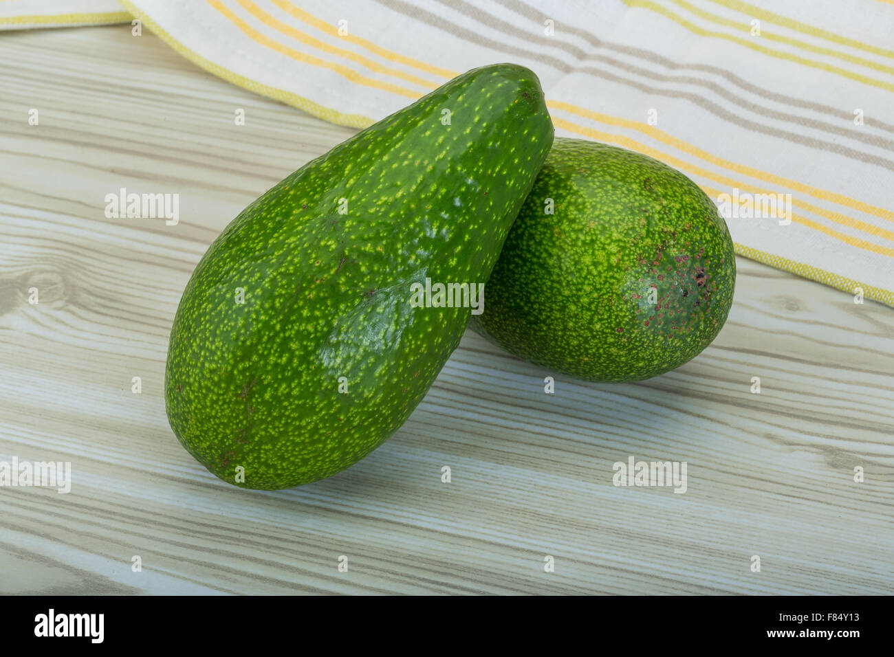 Two Ripe Avocados on the wooden background Stock Photo - Alamy