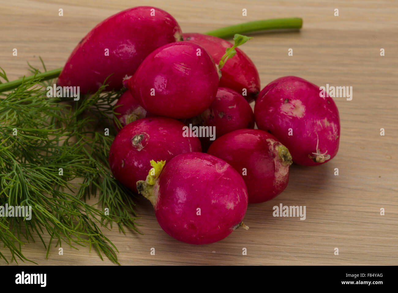 Radish with dill on the desk Stock Photo - Alamy
