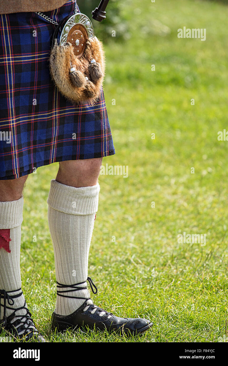 Bagpipe player dressed in Scottish National Dress including kilt and sporran with space for your text Stock Photo