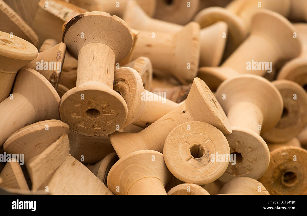Bobbins traditionally manufactured for wrappng thread, twine or string around great background for traditiona craftl manufacturi Stock Photo